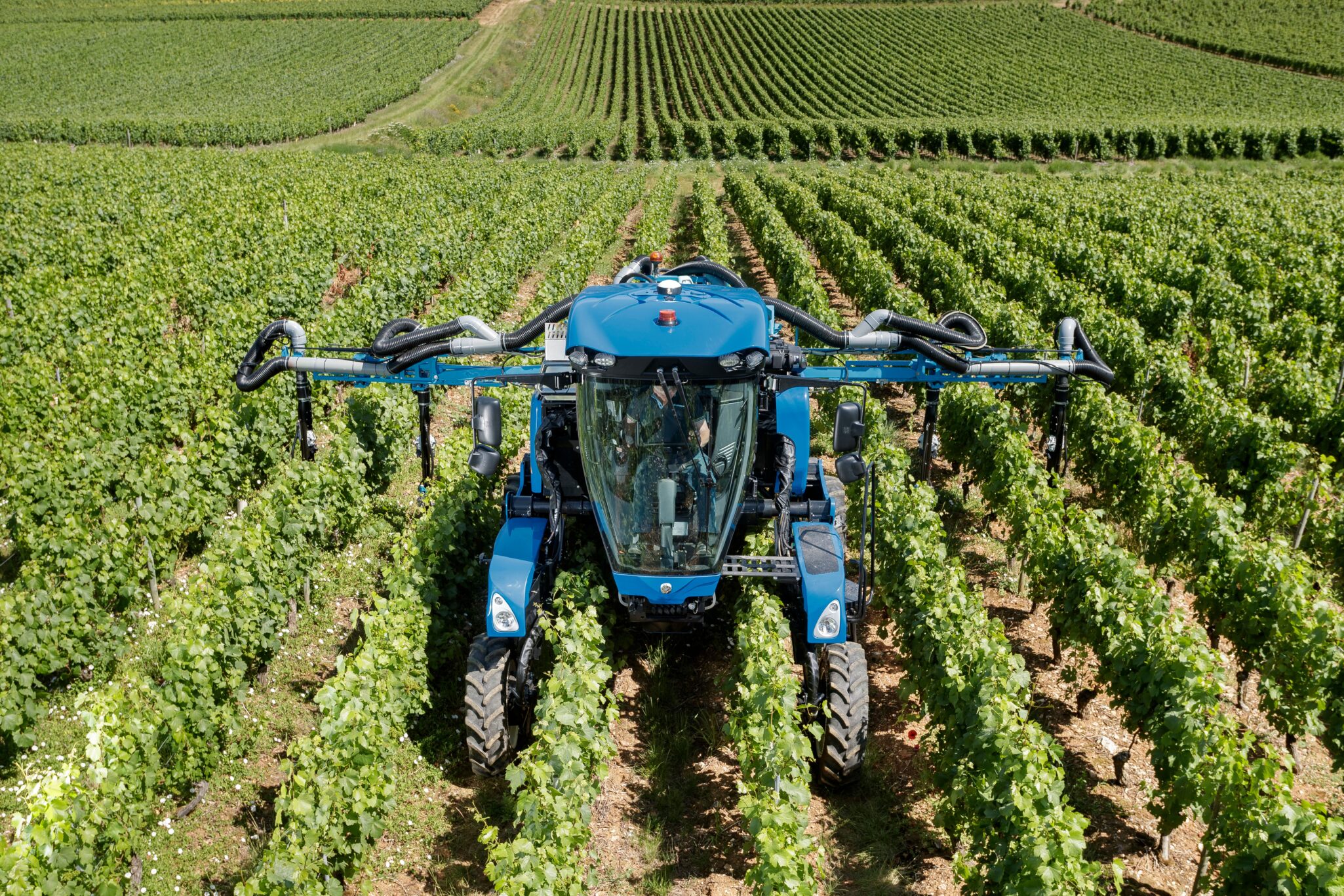 New Holland will introduce updates to the 9.80N narrow-row grape harvester & enhancements to TE6 Straddle Tractors.